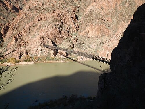 Kaibab Trail Suspension Bridge (Black Bridge), the footbridge over the Colorado River in the the Grand Canyon . The Black Bridge on the South Kaibab Trail, seen from above on the trail, in Grand Canyon National Park, Arizona. On December 8, 2013.