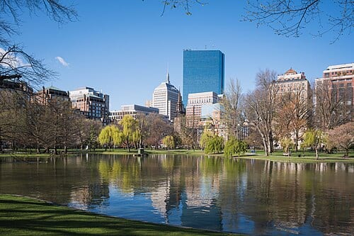 The lagoon of the Boston Public Garden with reflections of the Back Bay skyline (200 Clarendon), Boston, Massachusetts.