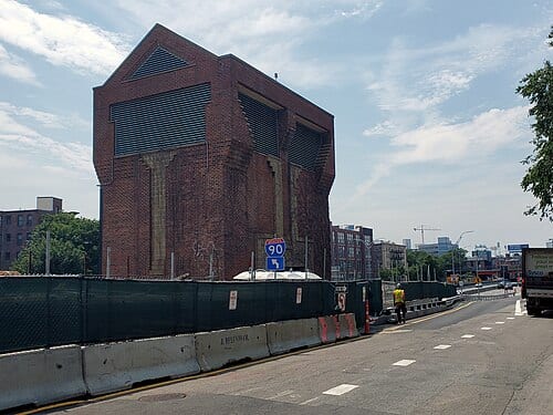 Green Line vent structure west of Massachusetts Avenue, seen in July 2021. At left is construction on the Parcel 12 property over the Massachusetts Turnpike. At right is Newbury Street and the Mass Pike on-ramp - the latter realigned as part of construction.