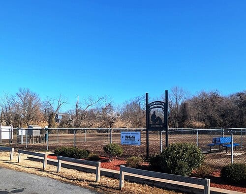 Photo of the Nick Mowers Dog Park in Pennsville , New Jersey . Photo taken from the park's parking lot along Riviera Drive looking east.