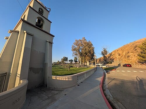 faux bell tower, park, street, and foothill of Mount Rubidoux