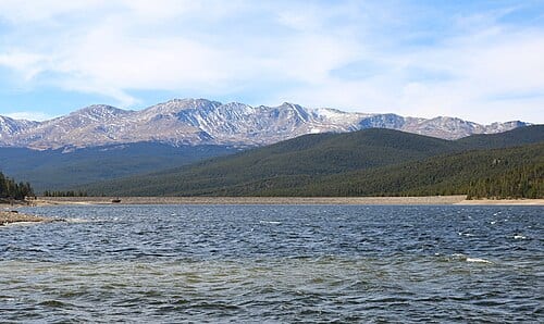 Turquoise Lake, a reservoir built and operated by the United States Bureau of Reclamation in Lake County, Colorado near Leadville. Its dam, Sugar Loaf Dam , is visible in the distance. The mountain is Mount Massive .