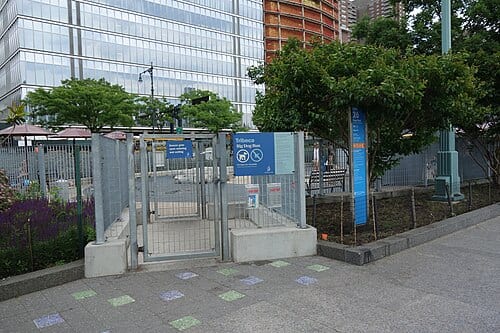 Looking at the Pier 26 Dog Run, a.k.a. the Tribeca Dog Run, across from Pier 26 near the south end of Hudson River Park, on the west side of West Street at North Moore Street north of Chambers Street in Tribeca, Lower Manhattan. Pictured is the checkpoint entrance to the big dog section of the dog…