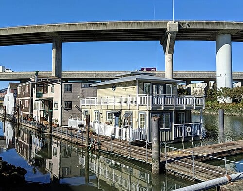 Houseboats on Mission Creek in San Francisco, with freeway access ramps above. Photo by Jim Heaphy.